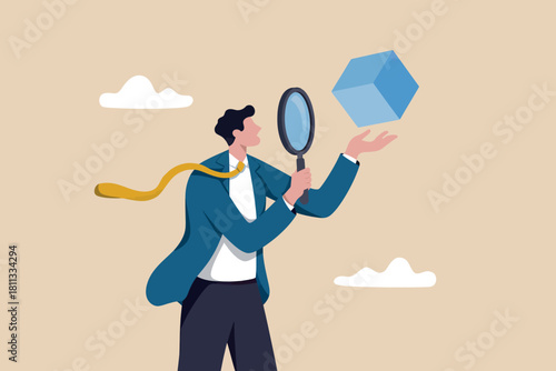 Businessman examining a floating blue cube with a magnifying glass
