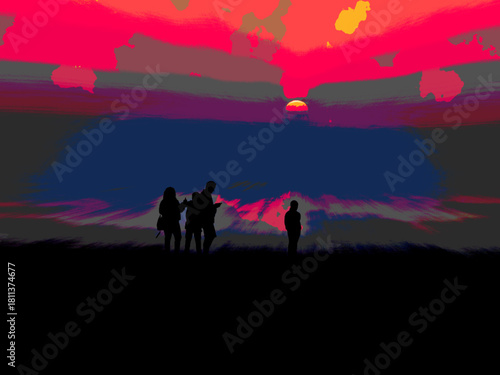 Family members admiring sunset on the beach