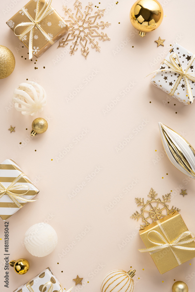 Naklejka premium A vertical warm Christmas and New Year setting featuring wrapped gifts, gold ornaments, and decorative snowflakes arranged around a soft beige backdrop, evoking celebration and seasonal joy