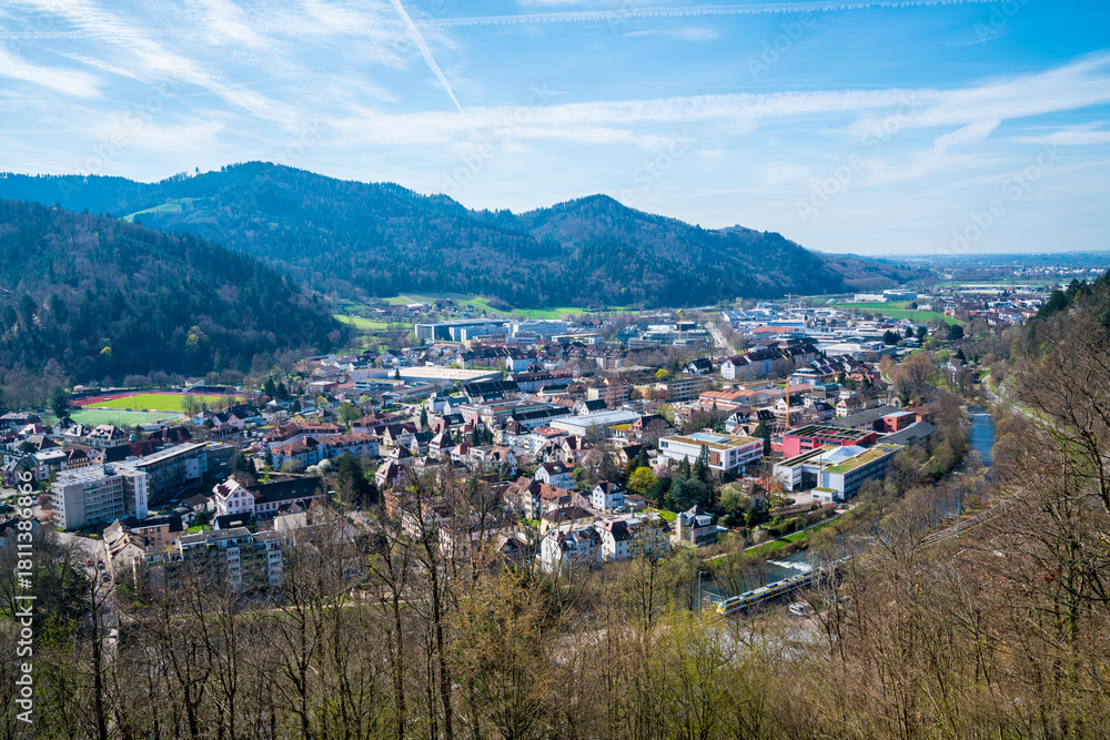 Obraz premium Germany, Waldkirch city houses in black forest schwarzwald nature landscape valley aerial panorama view above roofs with sunshine, view to freiburg im breisgau