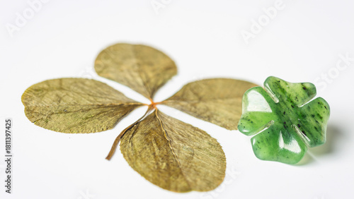Detail of four-leaf clovers on background