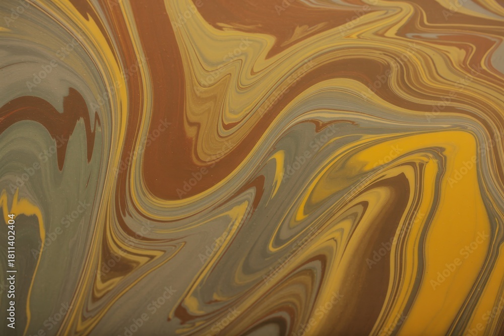 Obraz premium Swirls of brown and yellow abstract paint background texture