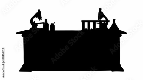 Silhouette of a science lab table with microscopes beakers and test tubes in a black and white image