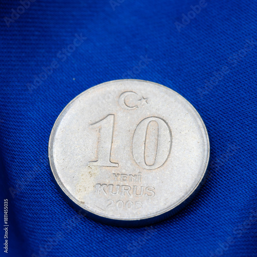 Fototapeta Naklejka Na Ścianę i Meble -  High Quality Macro of a Turkish Coin on Blue Background to show Turkeys Way into the EU. High quality photo