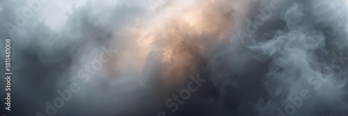 Dramatic sky with moody dark storm clouds illuminated by a golden sunset light creating a feeling of change and hope during a turbulent time