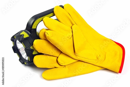 hand held torch and leather gloves on a white background 