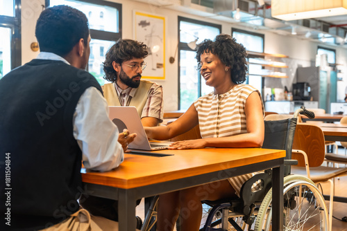 Diverse business colleagues collaborating in coworking office meeting