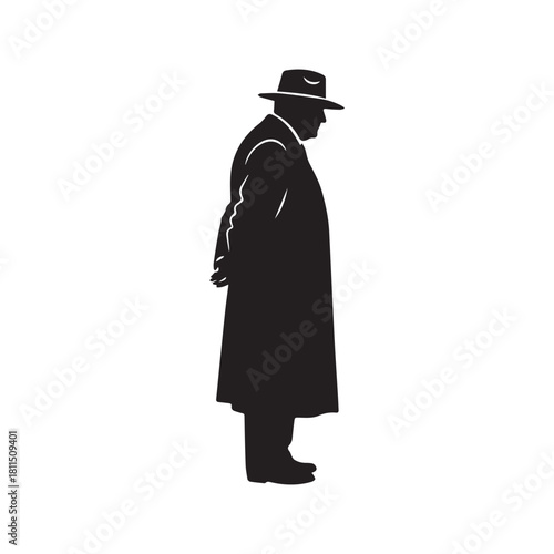 Silhouette of a Man in a Hat and Overcoat Standing in Profile

