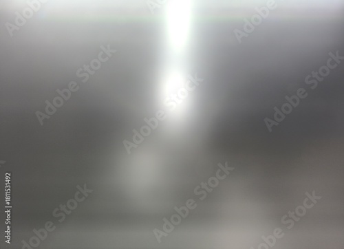 blurry metallic surface with bright light