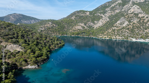 Fototapeta Naklejka Na Ścianę i Meble -  Aerial summer travel scene showing Ölüdeniz Blue Lagoon’s vivid turquoise sea