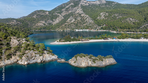 Fototapeta Naklejka Na Ścianę i Meble -  Scenic aerial footage capturing the bright blue lagoon and surrounding natural beauty.