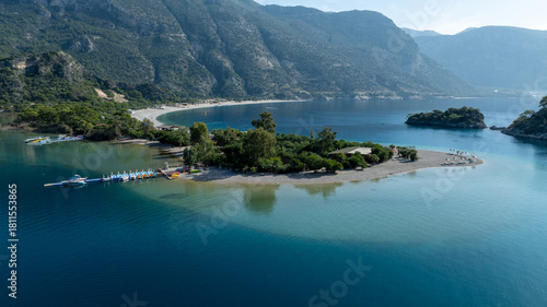 Fototapeta Naklejka Na Ścianę i Meble -  Aerial view of Ölüdeniz Blue Lagoon showing its iconic turquoise waters and summer coastline