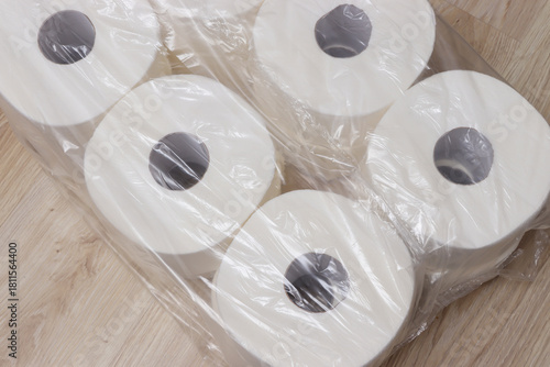 Rolls of toilet paper neatly packaged, showcasing essential household items. Ideal for home, restroom, or cleanliness themes, emphasizing comfort and necessity in daily life.
