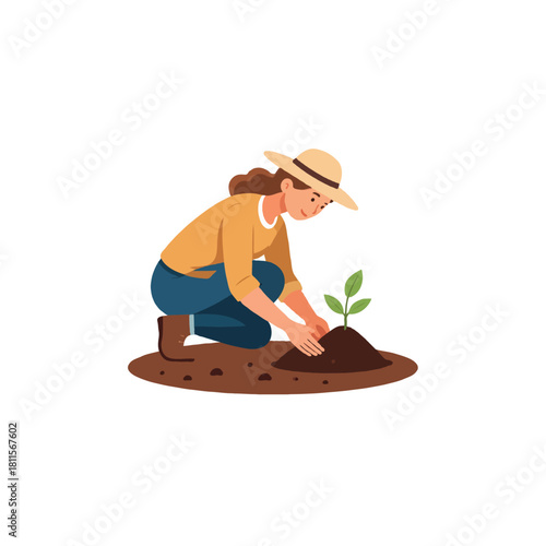 Female gardener lovingly planting new seedling into rich soil with a caring nurturing touch for