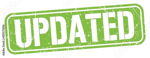 UPDATED text written on green stamp sign.