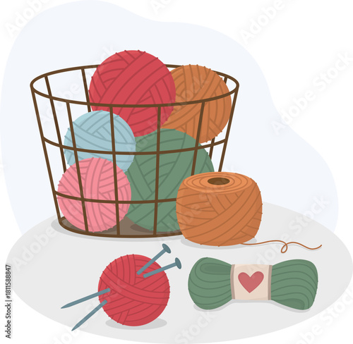 Still life with basket of colorful knitting yarn, skein and ball of thread with metal knitting needles. Handicraft concept with hobby and handmade craft supplies