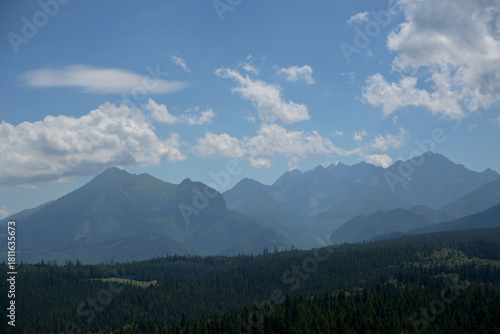Fototapeta Naklejka Na Ścianę i Meble -  High Tatras seen from a metal observation tower with a modern glass terrace offering a stunning panorama at Poronin, Poland. Majestic mountains peaks of High Tatra moutnains.