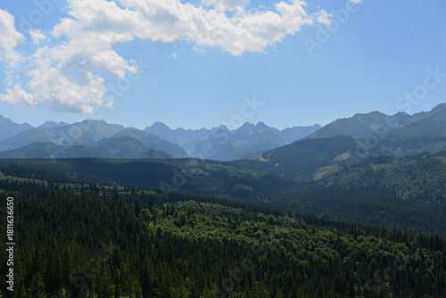 Fototapeta Naklejka Na Ścianę i Meble -  High Tatras seen from a metal observation tower with a modern glass terrace offering a stunning panorama at Poronin, Poland. Majestic mountains peaks of High Tatra moutnains.