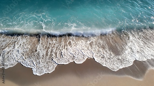 Fototapeta Naklejka Na Ścianę i Meble -  Crystal clear turquoise ocean wave breaking onto white sand beach