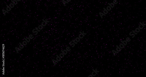 Red dust particles of varying sizes and transparency on a black background. Abstract glowing effect with a festive atmosphere.