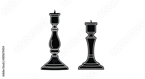 Two vintage black candlestick holders with ornate designs and classic silhouettes