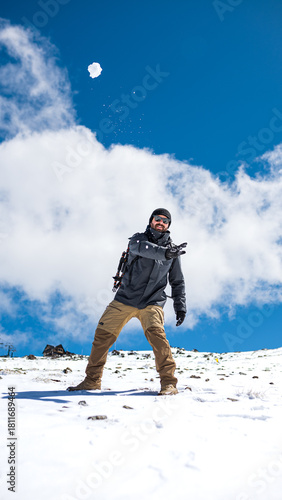 Man Throwing Snowball – Winter Adventure Lifestyle Photo