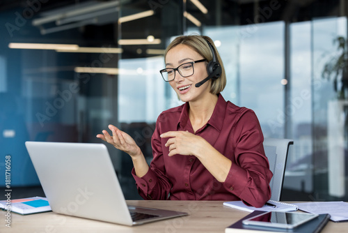 Canvastavla Young businesswoman wearing a headset while actively participating in a video ca