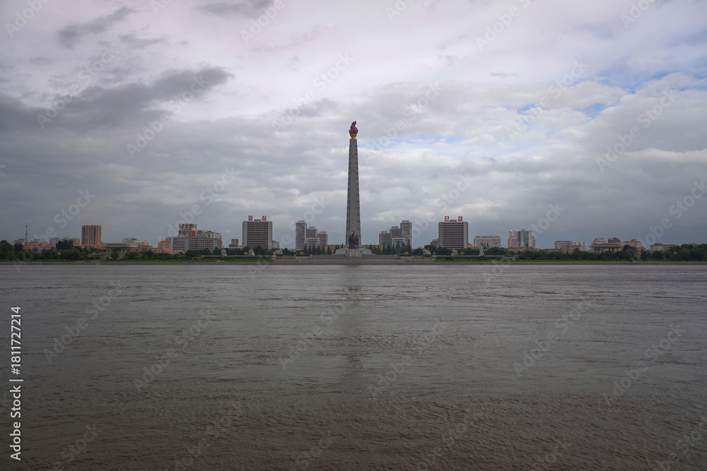 Obraz premium Panorama of the center of Pyongyang, riverside of Taedong river in North Korea. Cloudy summer view.