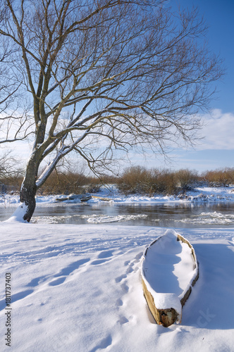A wooden boat moored at the bank