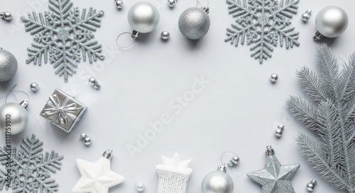 Elegant silver Christmas decorations on a light gray background