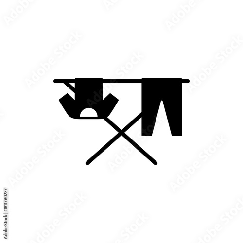 Clothes drying rack icon. Stand for dryer clothes. Portable folding clothes drying rack with a shirt and pants hanging to dry. Isolated vector illustration on white background.