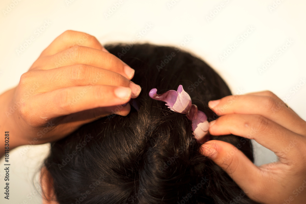 Fototapeta premium closeup women Woman Adjusting Hair clip