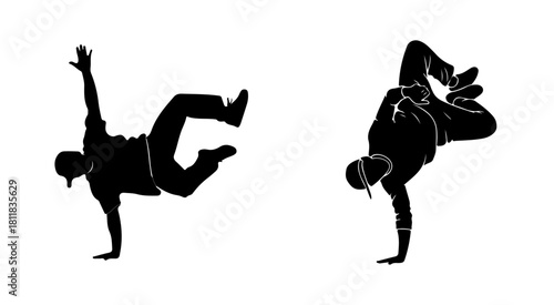 Two breakdancers performing acrobatic moves in silhouette style