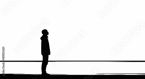 Silhouette of a Person Gazing Upward in Minimalist Black and White.