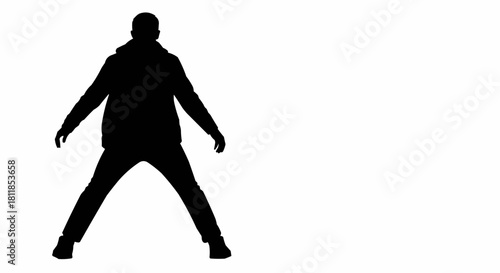 Silhouette of a Person with Arms Outstretched and Legs Apart.