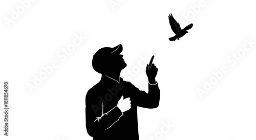 Silhouette of a man in a cap pointing at a flying bird.