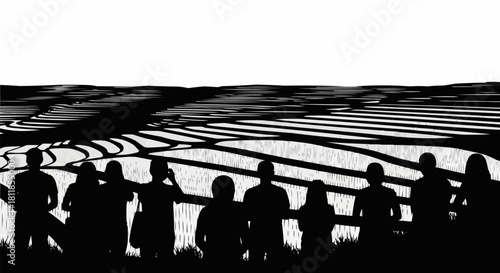 Silhouetted group of people observing a vast landscape.