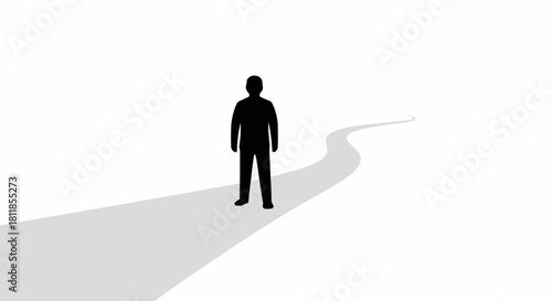 Silhouette of a man standing on a winding path.