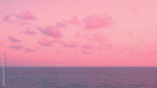 Amazing sea view and pink sky colorful clouds and sun horizon time lapse. 4K Rose seascape calm ocean and pink sunset colored skyscraper with cumulus clouds in sunlight timelapse, beach travel vacatio