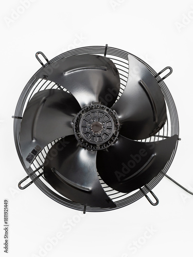 Black industrial metal fan on a white background. Ventilation equipment.