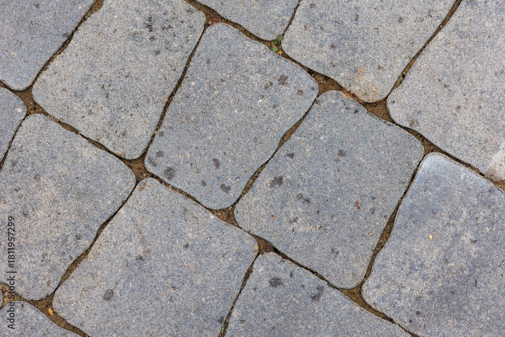 Obraz premium Minimalistyczny detal miejskiej architektury przedstawiający brukowaną nawierzchnię i geometryczne linie. Uniwersalne tło do projektów designerskich i nowoczesnych kompozycji.