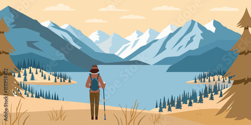 Female hiker overlooking a lake surrounded by mountains and evergreen trees