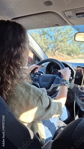 Driving, Road Trip, Woman traveling alone in a modern car on a sunny highway during a relaxing fall journey.