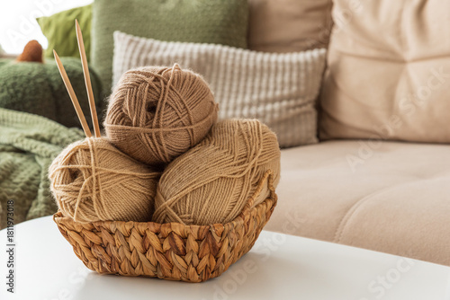 Basket with Yarn Balls on White Table in Cozy Living Room