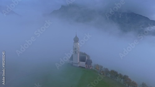 Wallpaper Mural Drone view of church of San Valentino with misty Dolomites, Italy. Torontodigital.ca