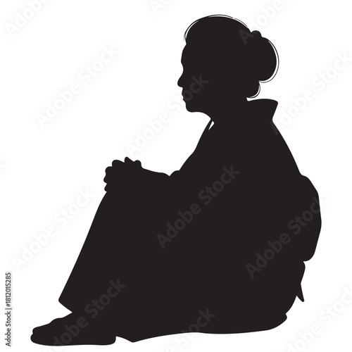 Silhouette of an Elderly Woman Sitting in Traditional Attire, Engaged in Thought