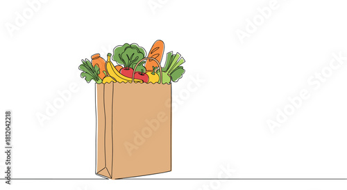 A brown paper grocery bag filled with colorful fruits and vegetables and a loaf of bread.