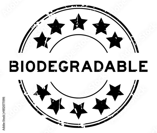 Grunge black biodegradable word with star icon round rubber seal stamp on white background