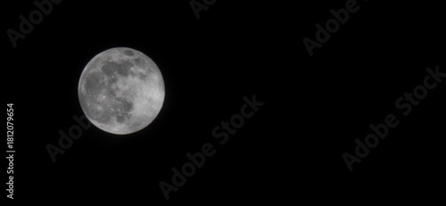 Photograph of an full moon in a dark sky. Image taken with a mobile phone lens with maximum zoom. Luminous moon with ethereal glow against pitch black sky. Supermoon, Night sky images
