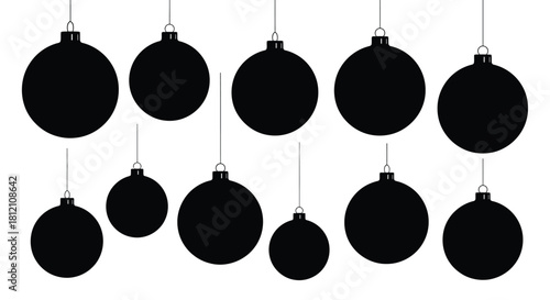 A simple arrangement of black christmas ornaments hanging from white strings